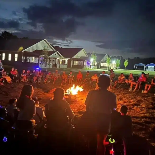 a group of people standing in front of a crowd
